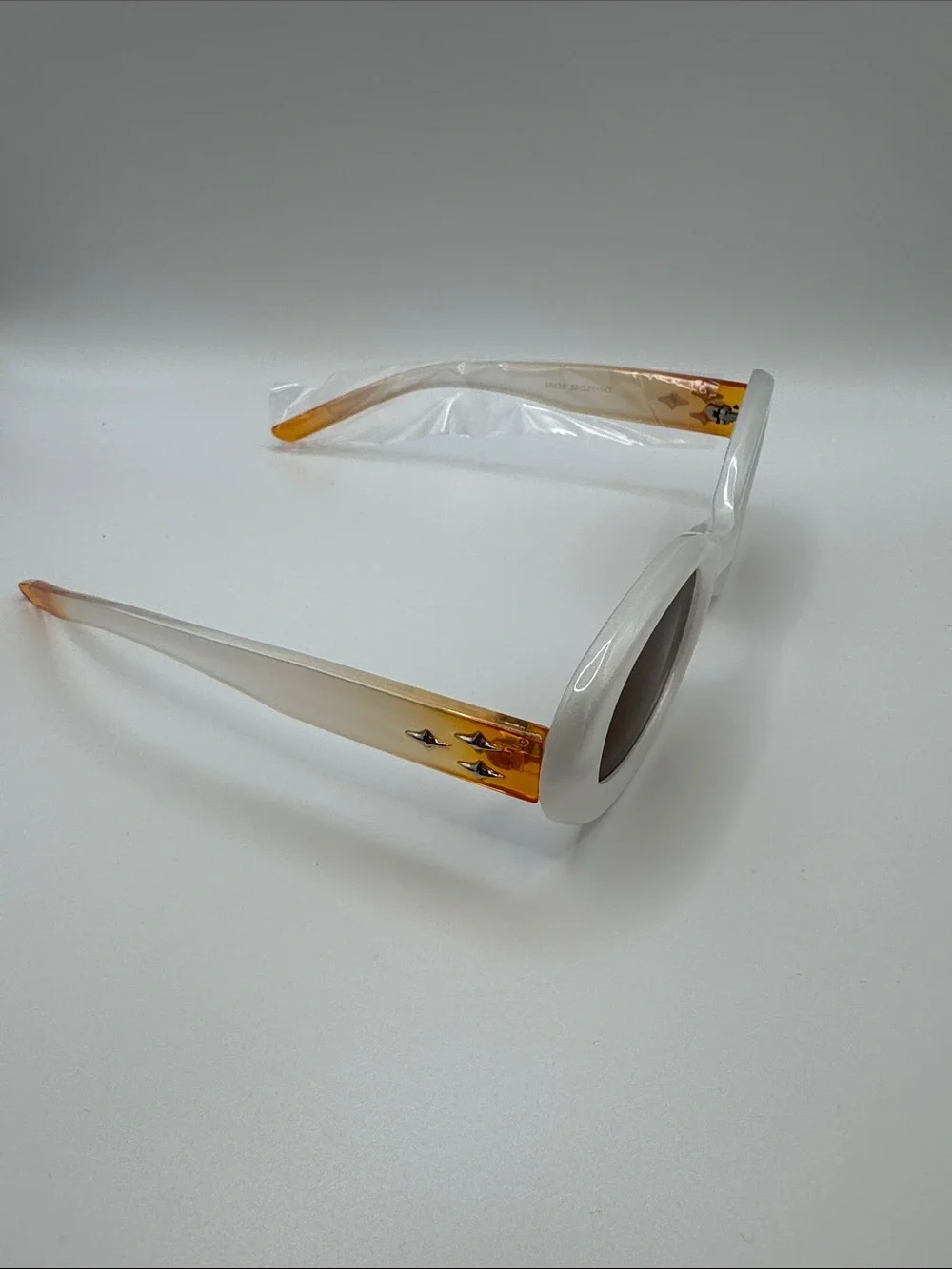 White Oval Sunglasses with Brown Lenses